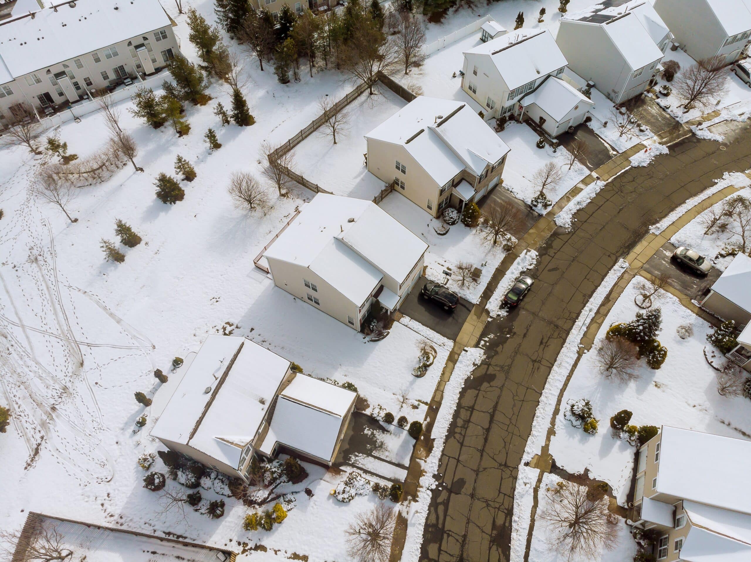 A perfect neighbourhood houses in suburb at winter the north America homes covered nice snow of aerial view